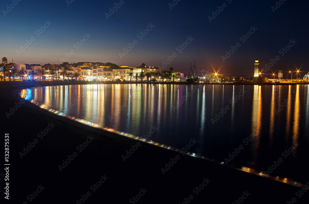 view of night city and beach