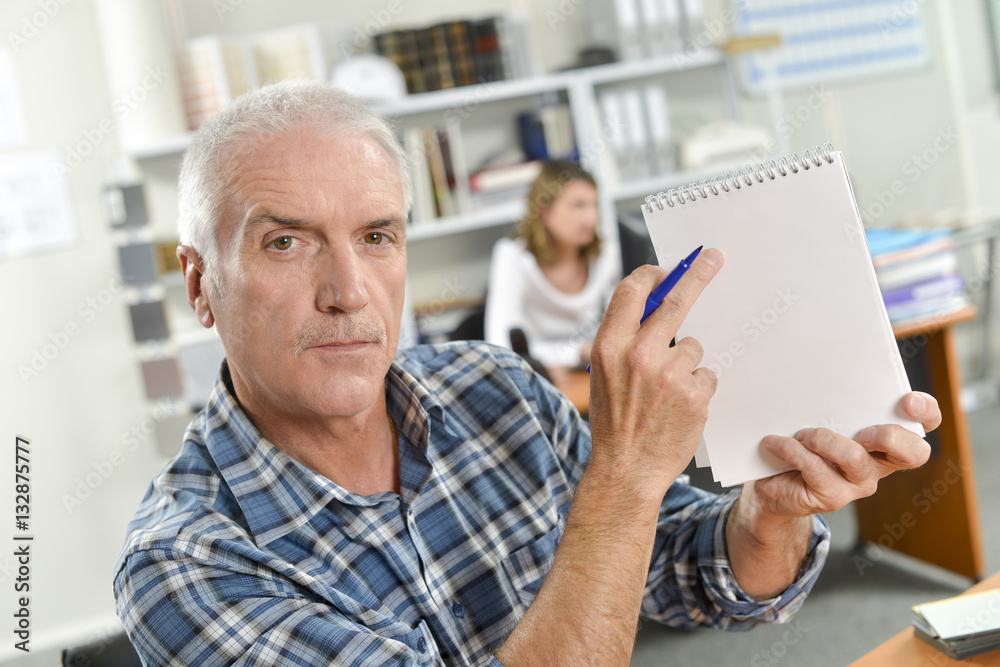 Pointing to a notepad