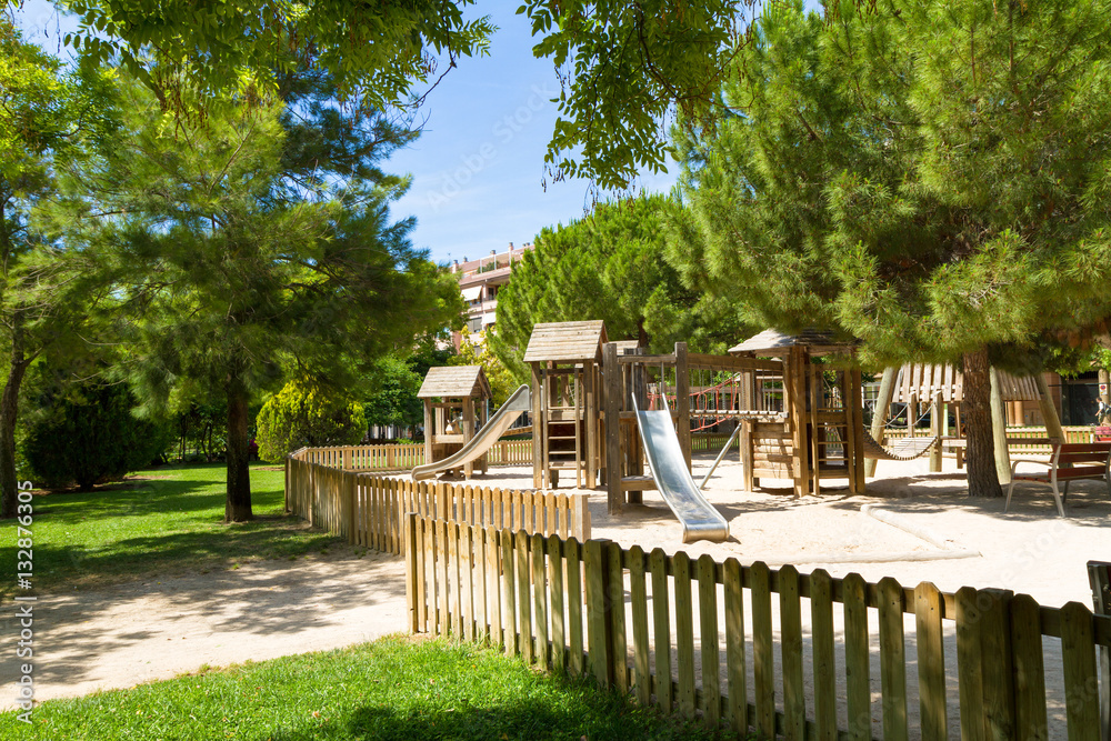 Children's wooden playground recreation area at public park