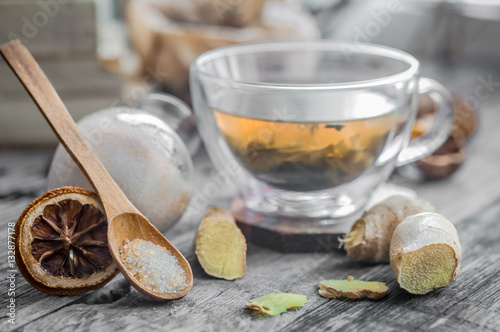 still life with transparent Cup of tea on wooden background