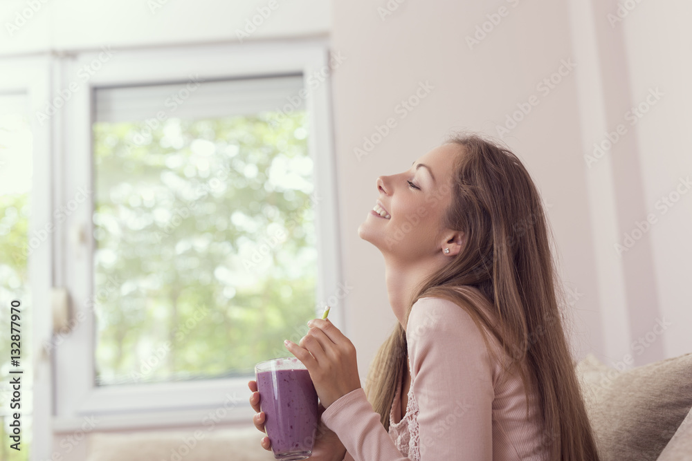 Woman drinking smoothie Woman drinking smoothie