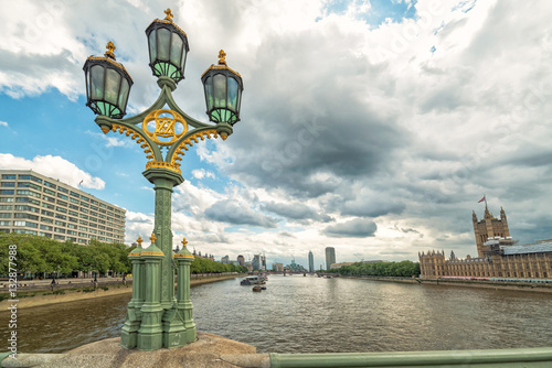 Westminister bridge lamppost with Thames river background photo