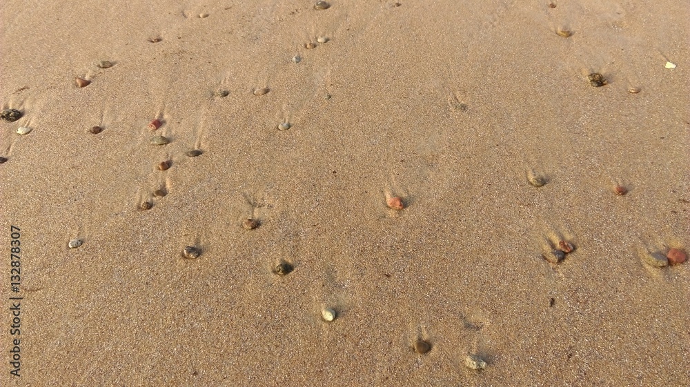 Little stones on sand in the beach Little stones on sand in the beach