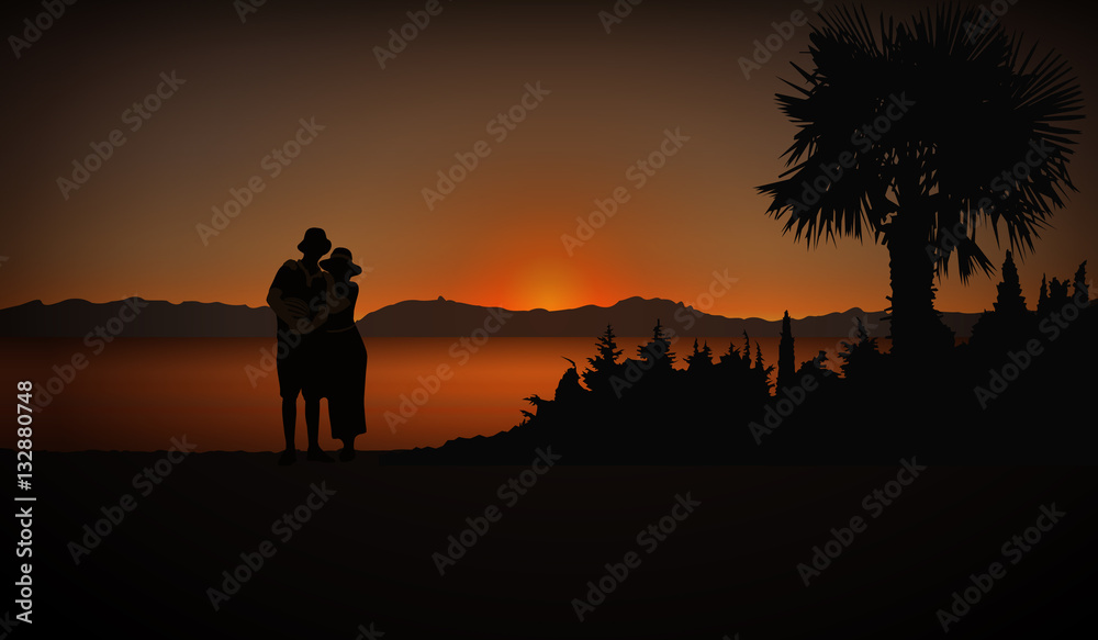 Tourists (Loving couple) in cost with palm trees. Evening. Sunset.