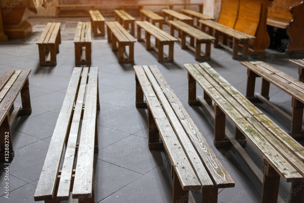 Old wooden benches. Benches on church floor. Welcome to the God's temple. Old wooden benches. Benches on church floor. Welcome to the God's temple.