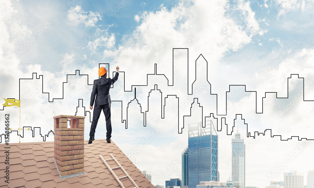 Man architect draw silhouette of modern city on blue sky. Mixed Man architect draw silhouette of modern city on blue sky. Mixed
