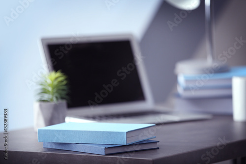 Books on table, on blurred background