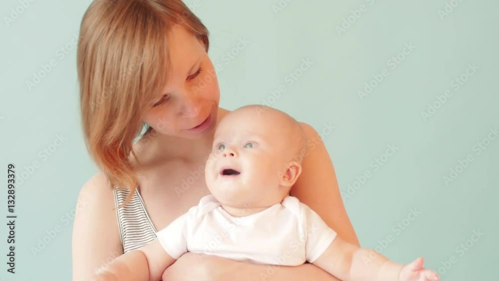 Smiling woman with her baby. Family concept. Smiling woman with her baby. Family concept.
