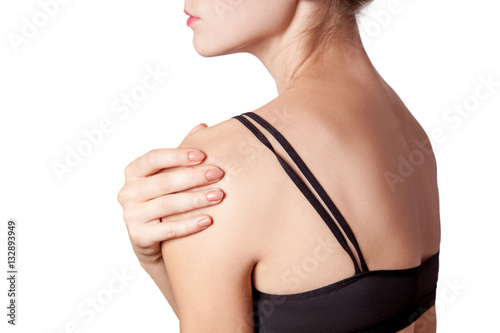 young woman with pain on her arm and shoulder. isolated on white background. 