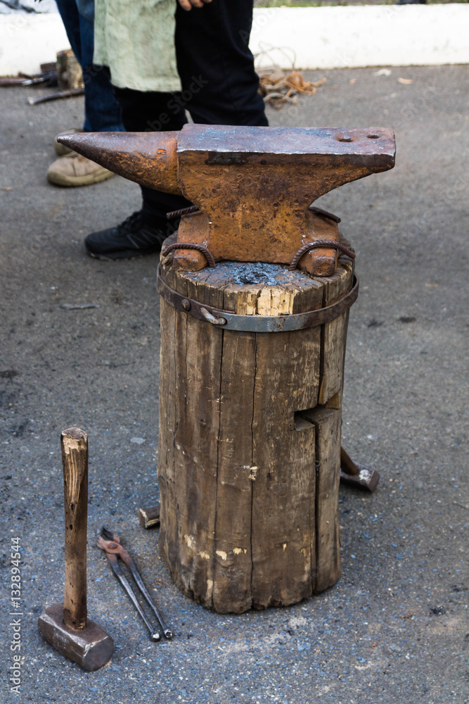 Anvil on a wooden stump top view. Anvil on a wooden stump top view.