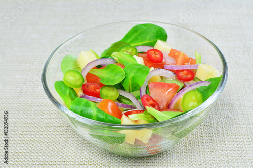 Fresh vegetable salad in glass bowl on the table