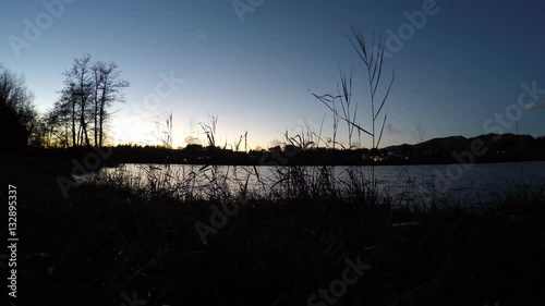 cold wind on the lake at dusk - wilderness  lake of Sartirana Italy  photo