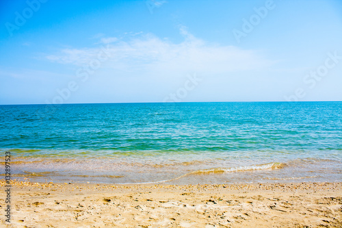Adriatic Sea coast view. Seashore of Italy, summer sandy beach with clouds on horizon. © saint_antonio
