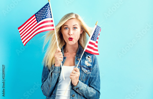 Young woman holding American flag