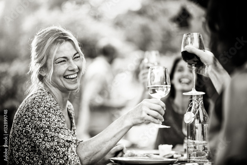 Photography Group of friends doing a bbq, focus on a woman