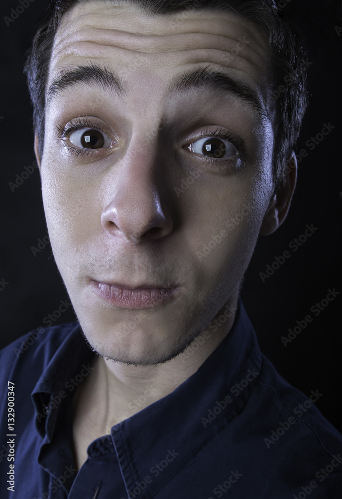 Obraz premium young man silly faces portrait