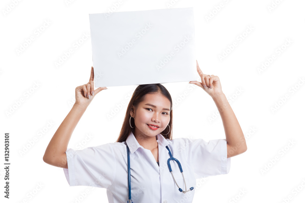 Young Asian female doctor show a blank sign over head. Young Asian female doctor show a blank sign over head.