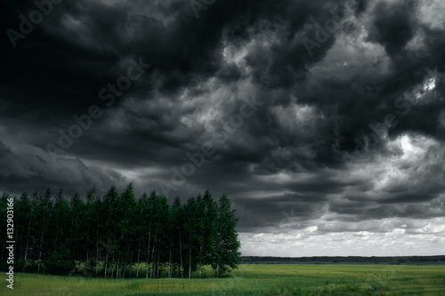 Dramatic thunder storm clouds at dark sky. Nature landscape