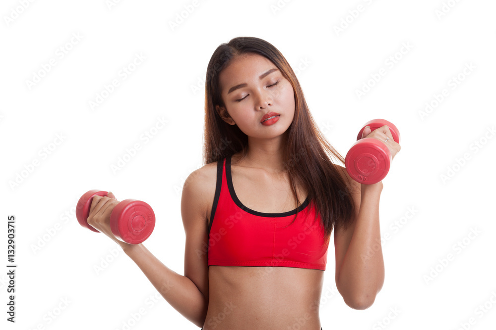 Tired Asian healthy girl exercise with dumbbell.