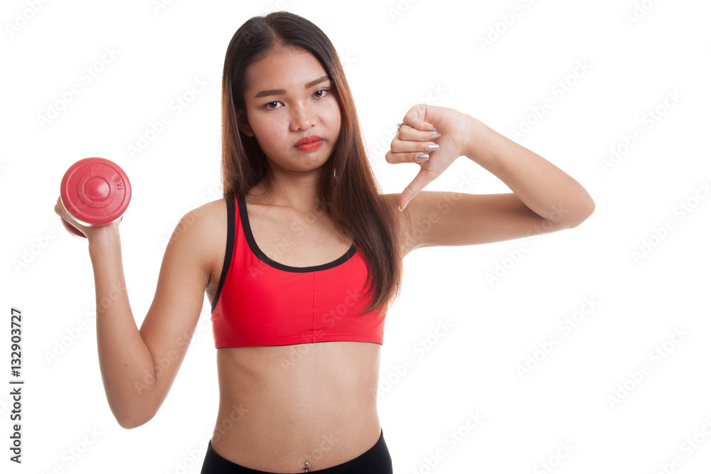Beautiful Asian healthy girl thumbs down with dumbbell. Beautiful Asian healthy girl thumbs down with dumbbell.