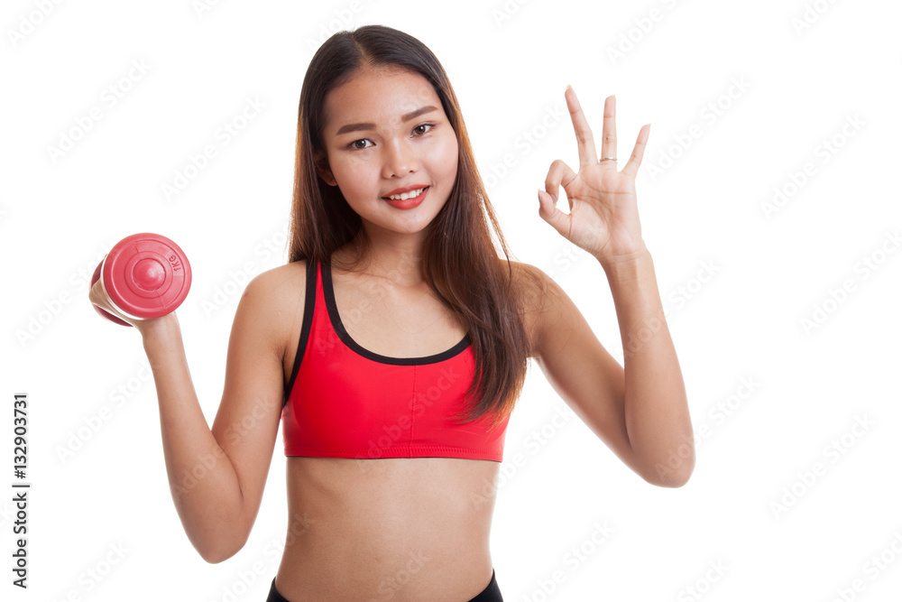 Beautiful Asian healthy girl show OK with dumbbell. Beautiful Asian healthy girl show OK with dumbbell.