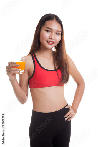 Beautiful Asian healthy girl drinking  orange juice.