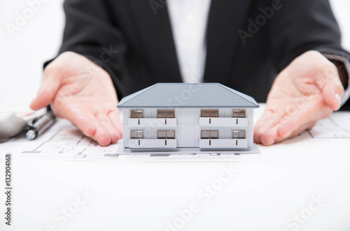 Real estate agent and house model