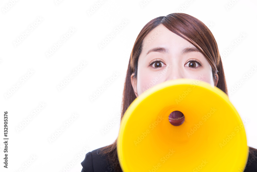 Young woman making announcement with megaphone Young woman making announcement with megaphone