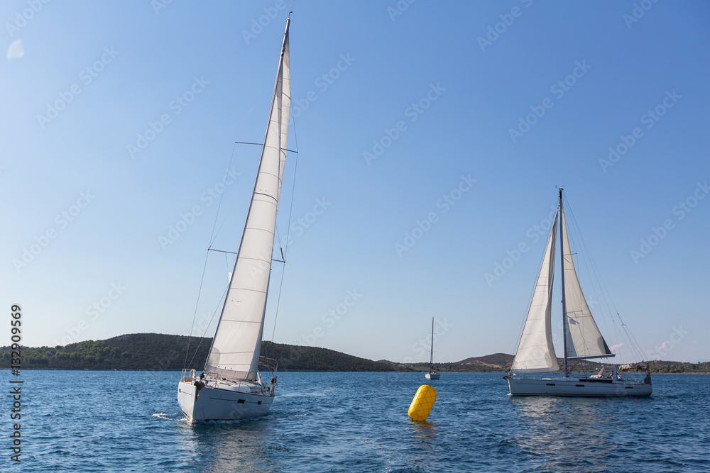 Fototapeta premium Yachts at Sailing regatta at the Sea. Luxury boats.