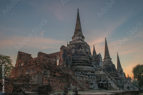 Ayutthaya, Thailand. - Dec. 10, 2016: tourists waiting to see sunset at Ancient ruins of the temple Wat Phra Sri Sanphet national historic site.   photo