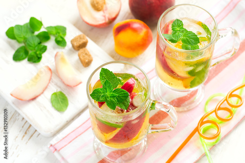 Peach ice tea and ingredients, selective focus