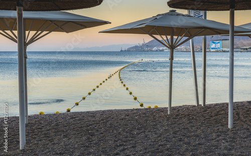 Fototapeta Naklejka Na Ścianę i Meble -  Morning at central public beach of Eilat - number one resort and recreational city in Israel located on the Red Sea