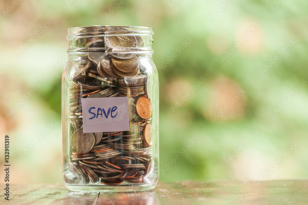Jar of full coins in concept money saving Jar of full coins in concept money saving