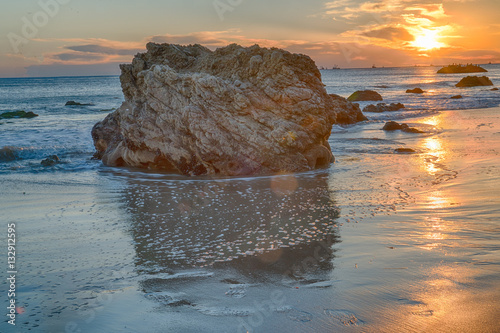 Sunset over the Pacific Ocean and the rocks at El Matador State Beach near Malibu California photo