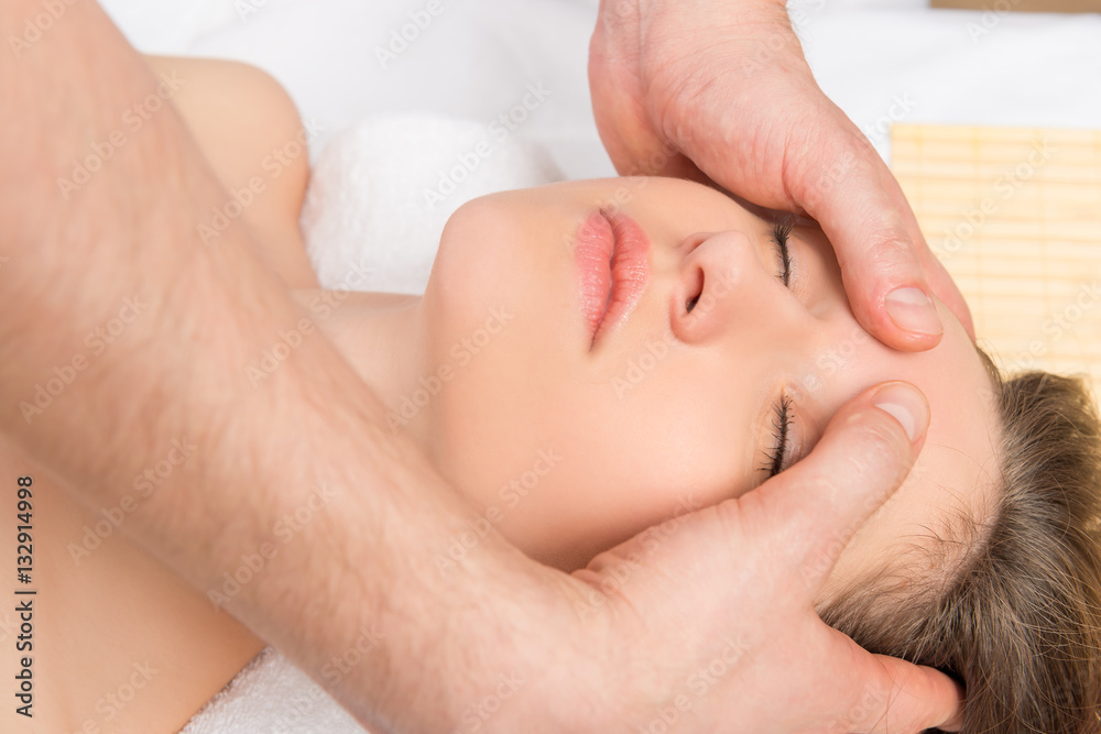 girl's face close-up and massage the skin of the forehead girl's face close-up and massage the skin of the forehead