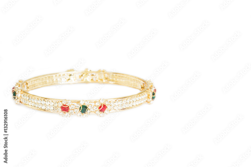 Gold bracelets with gem and diamonds isolate on white background. Gold bracelets with gem and diamonds isolate on white background.