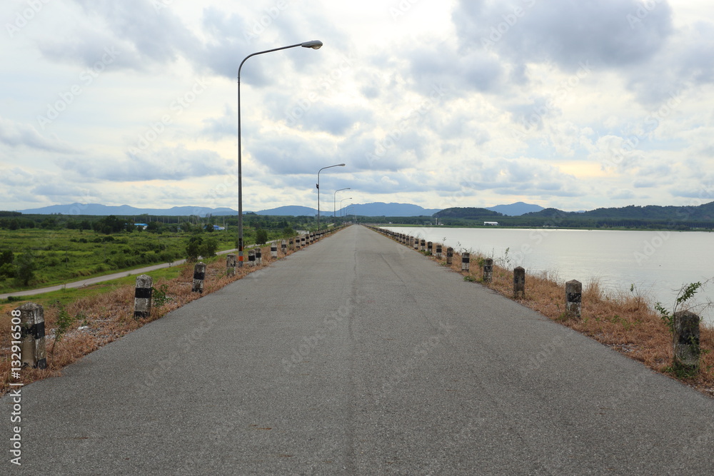 The road on the dam in Pra Sae Reservoir at Rayong, Thailand