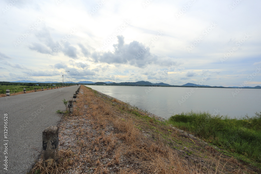 The road on the dam in Pra Sae Reservoir at Rayong, Thailand