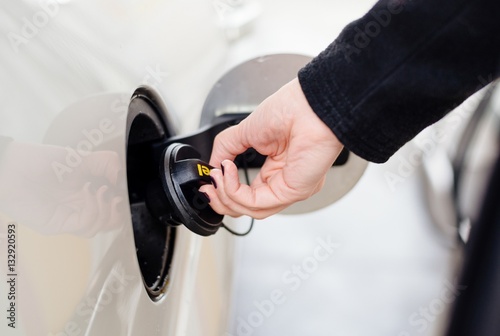 Woman opening diesel fuel cap