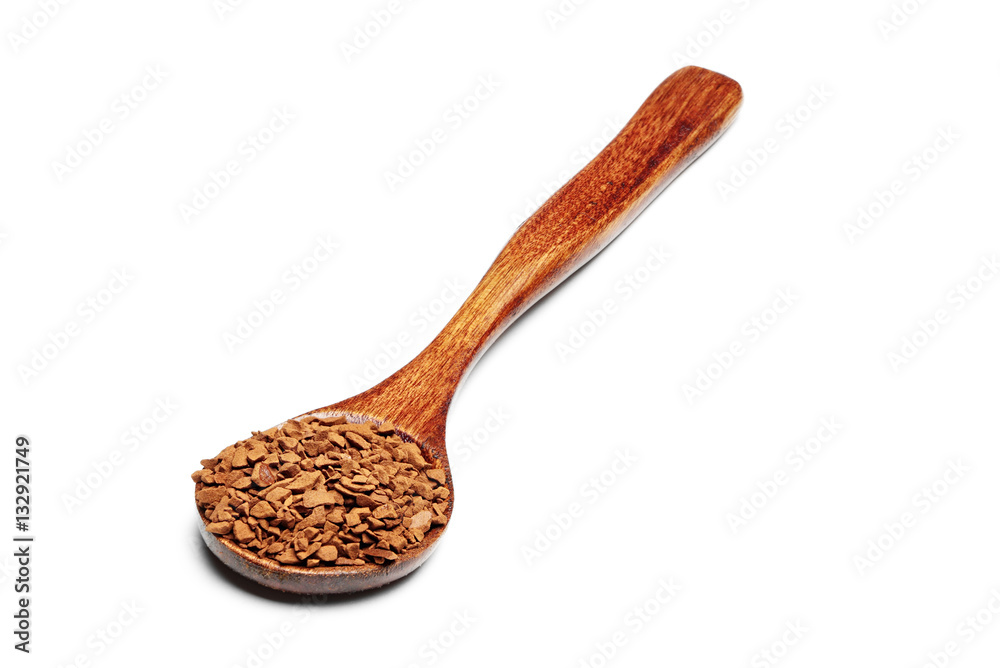 instant coffee in a wooden spoon isolated on white background instant coffee in a wooden spoon isolated on white background