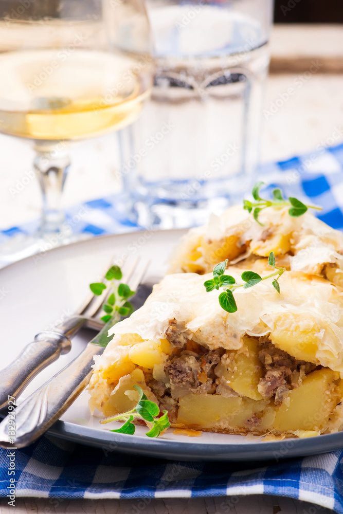 strudel with potatoes and forcemeat. .selective focus. strudel with potatoes and forcemeat. .selective focus.