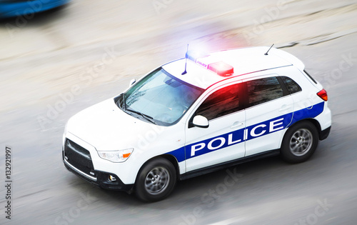 Police car in motion blur with flashing lights photo