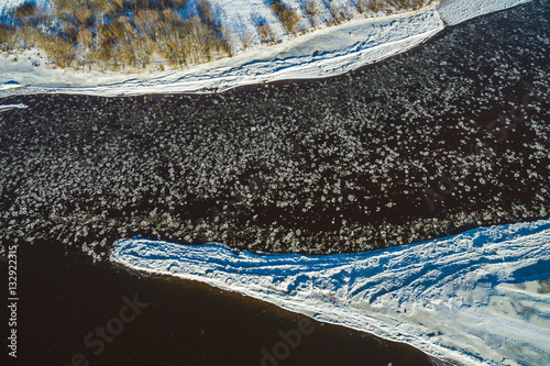 Winter river with ice floes, drone aerial image
 photo