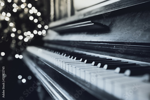 Old vintage piano keyboard. The beautiful background blur © Dmitriy Shipilov