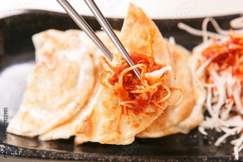 Fried Dumplings with Vegetables in Spicy Sauce photo