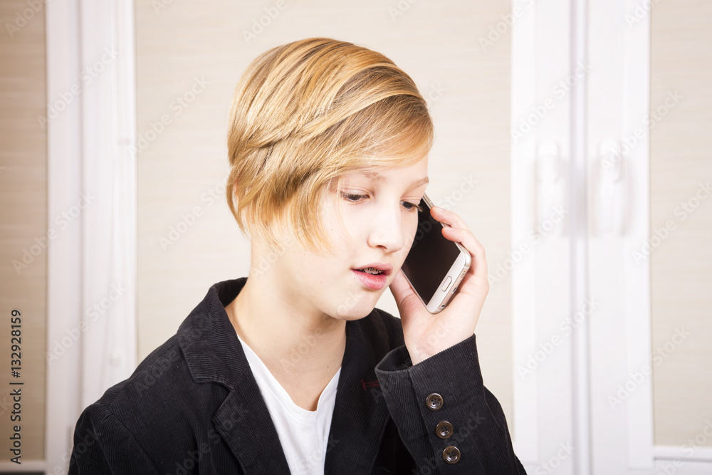 Teen with phone in hands. Conversation on the smartphone, modern communications. Teen with phone in hands. Conversation on the smartphone, modern communications.