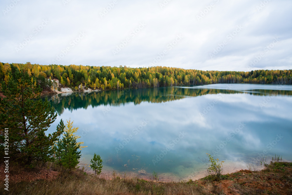 Quiet lake in the autumn forest