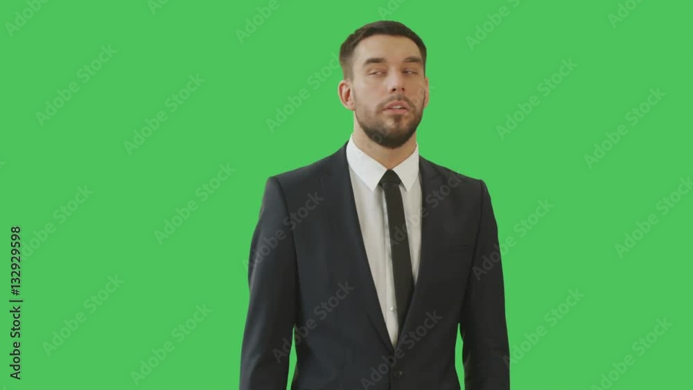 Medium Shot of a Serious-Minded Businessman While Camera Rotates around Him. Shot on with Green Screen Background. Shot on RED Cinema Camera 4K (UHD). Medium Shot of a Serious-Minded Businessman While Camera Rotates around Him. Shot on with Green Screen Background. Shot on RED Cinema Camera 4K (UHD).