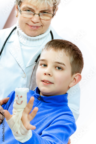 Doctor examining a child in a hospital photo