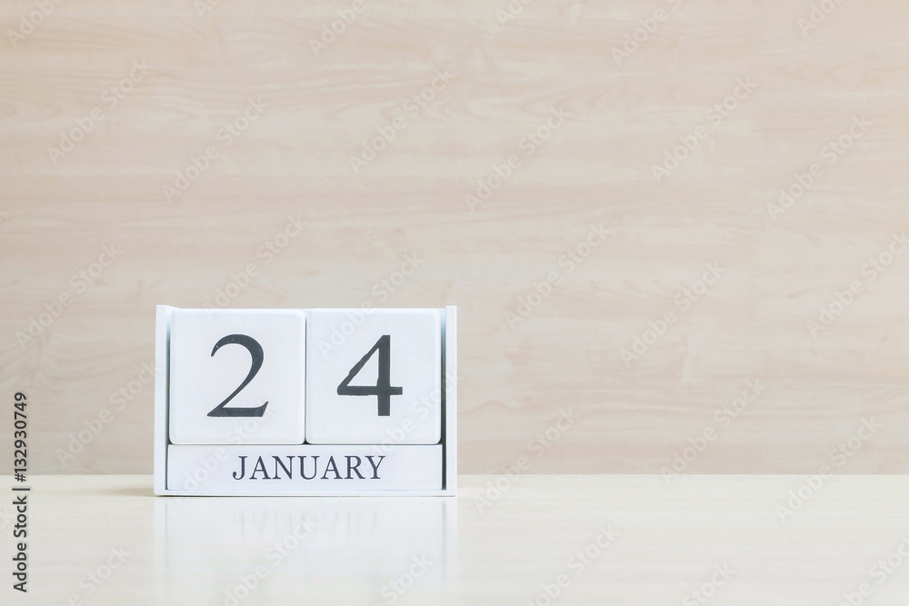Closeup surface white wooden calendar with black 20 january word Closeup surface white wooden calendar with black 20 january word